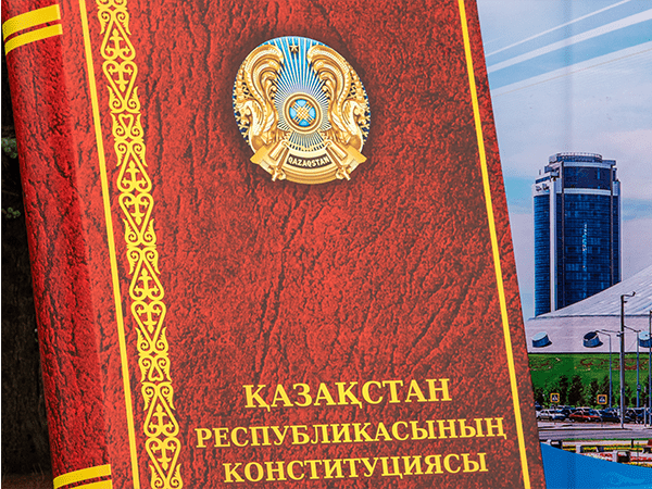 A image of a book. The title, in Cyrillic, reads, "The constitution of the Kazakstan republic."